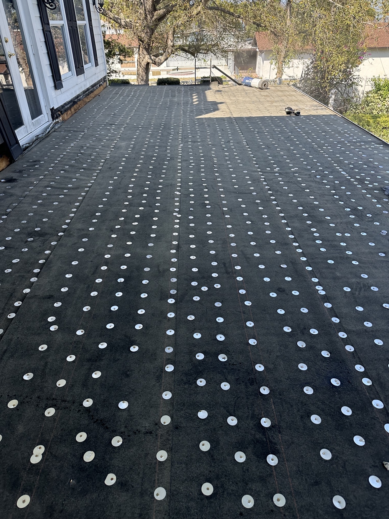 Close-up of base sheet fastener pattern on a flat roof