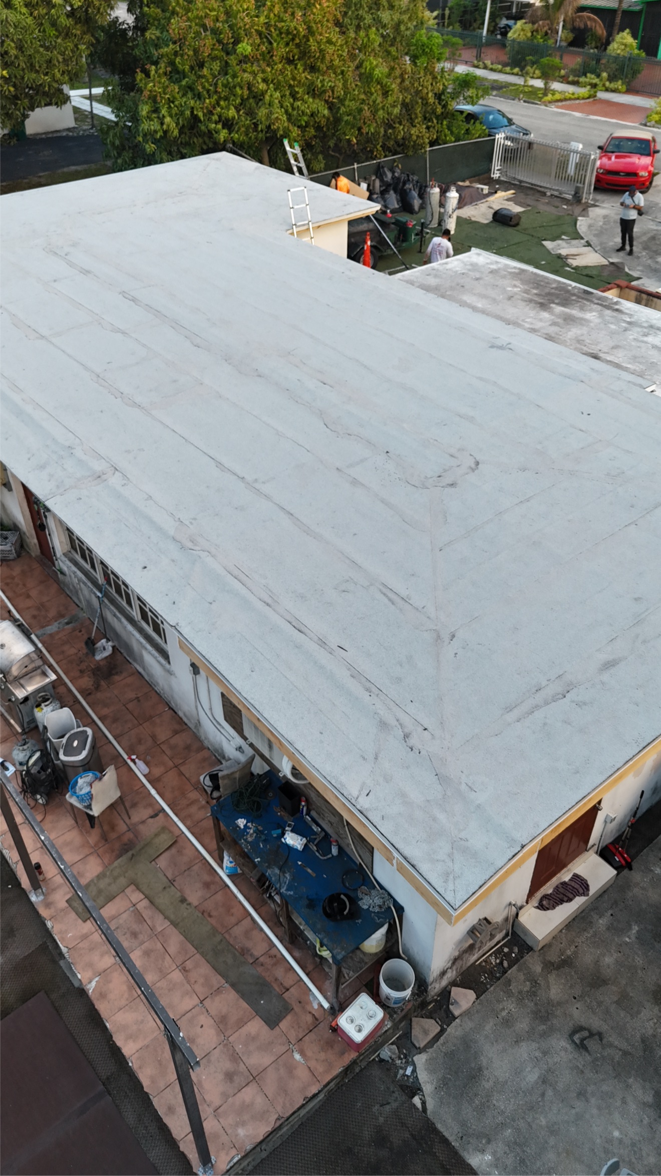 Aerial of a finished flat roof next to a pool