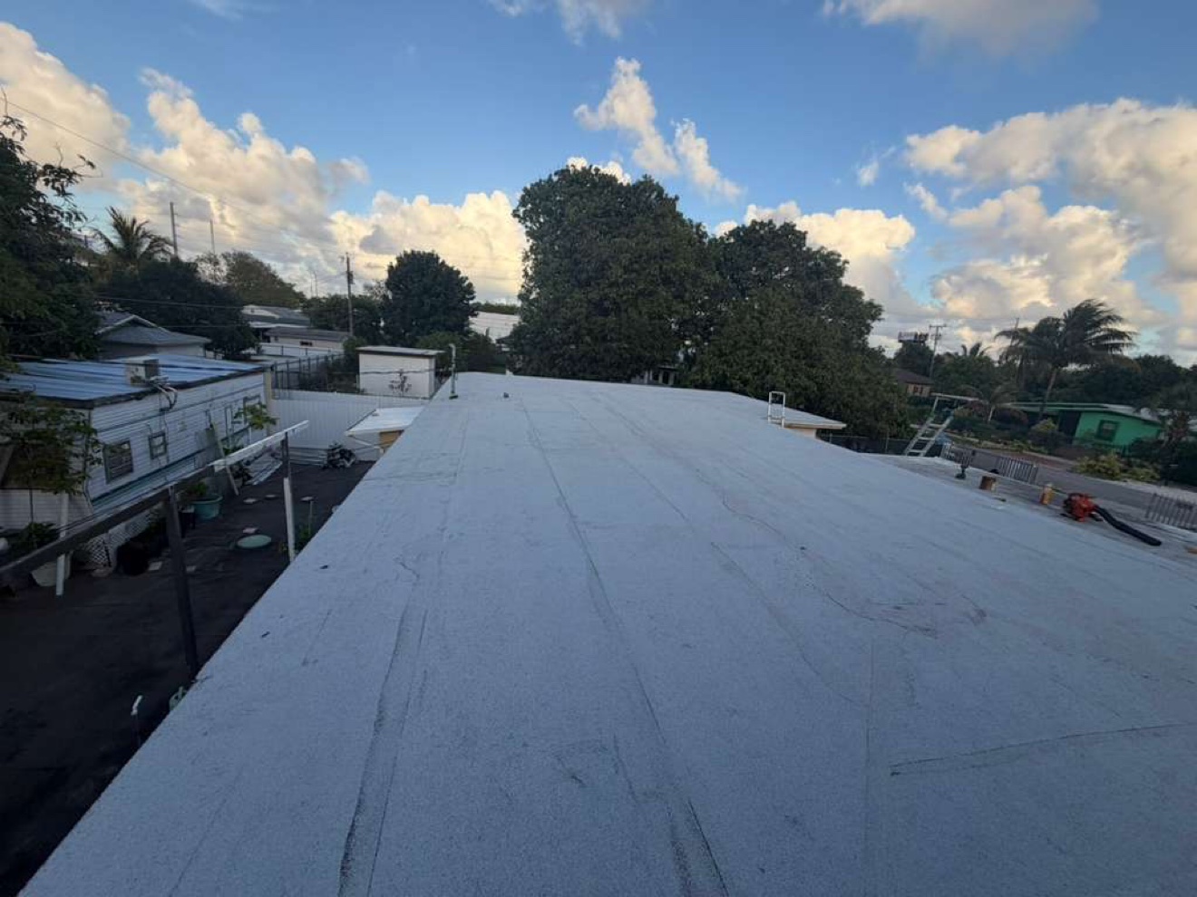 Finished flat roof with white cap sheet, wide view