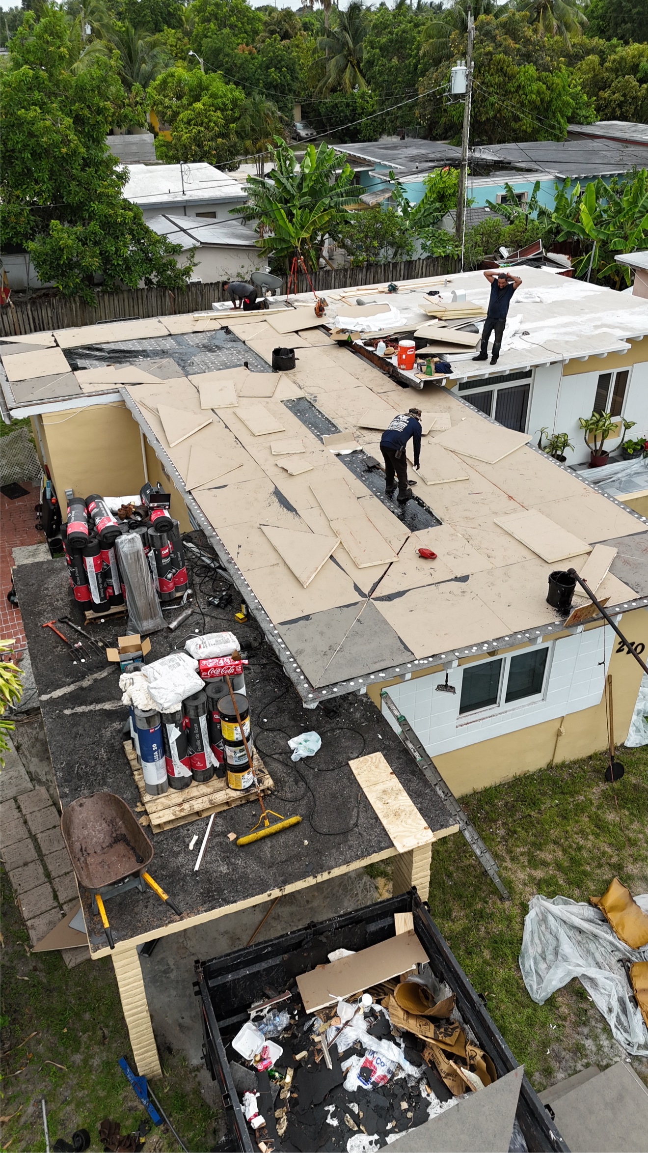 Aerial of flat roof with insulation boards being installed