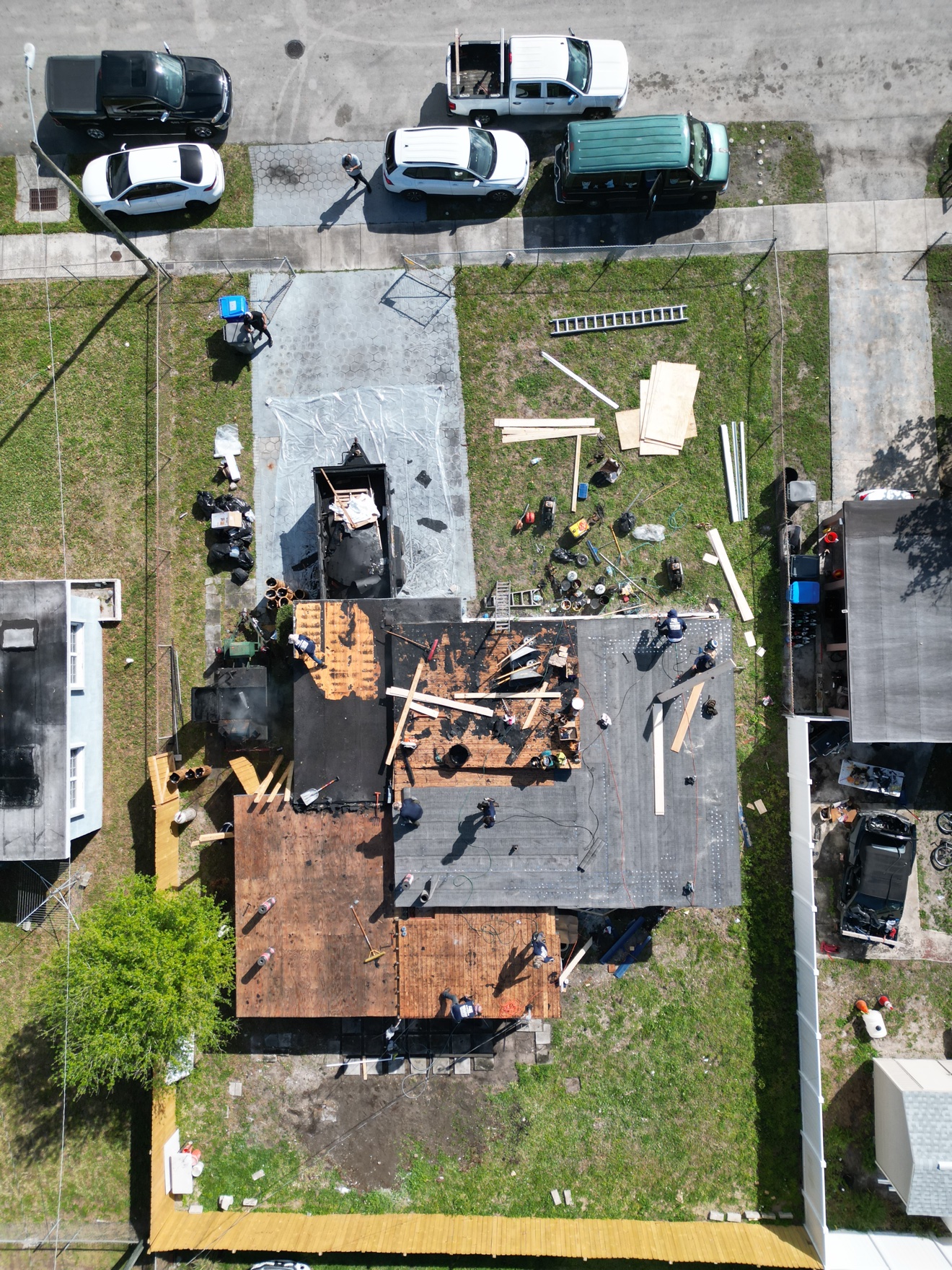 Aerial of flat roof tear-off in progress