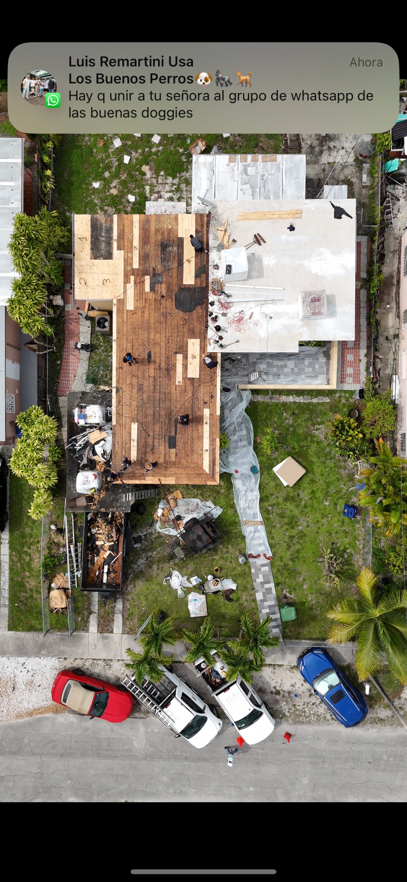 Aerial of flat roof tear-off in progress with old deck exposed