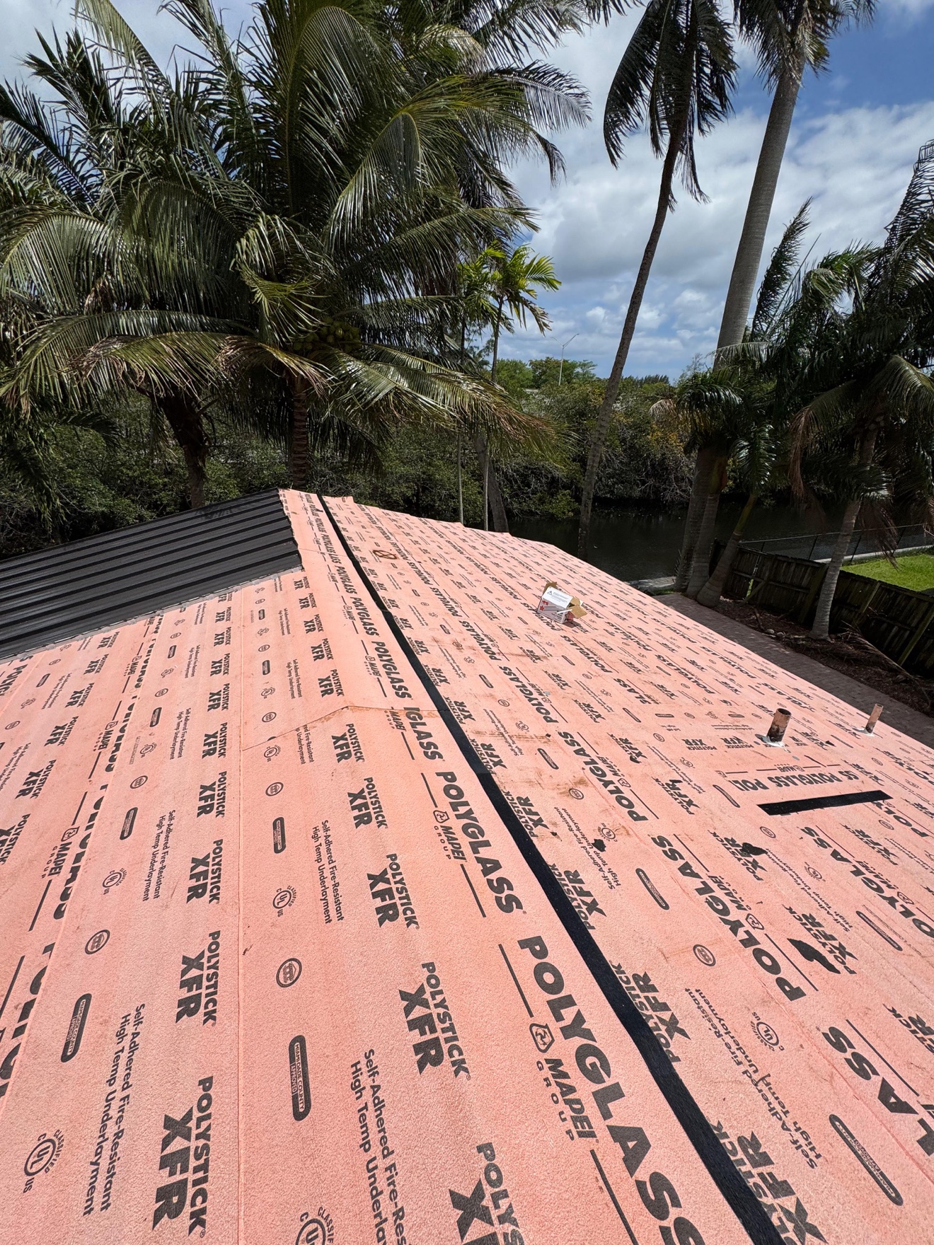 Standing seam metal panels going in over the underlayment