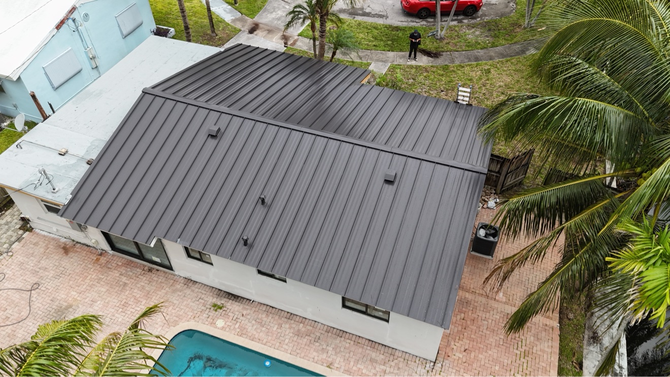 Completed metal roof aerial showing panel alignment