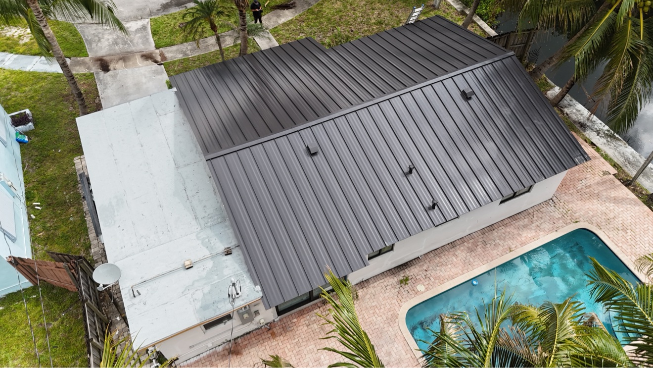 Aerial of finished metal roof with ladder