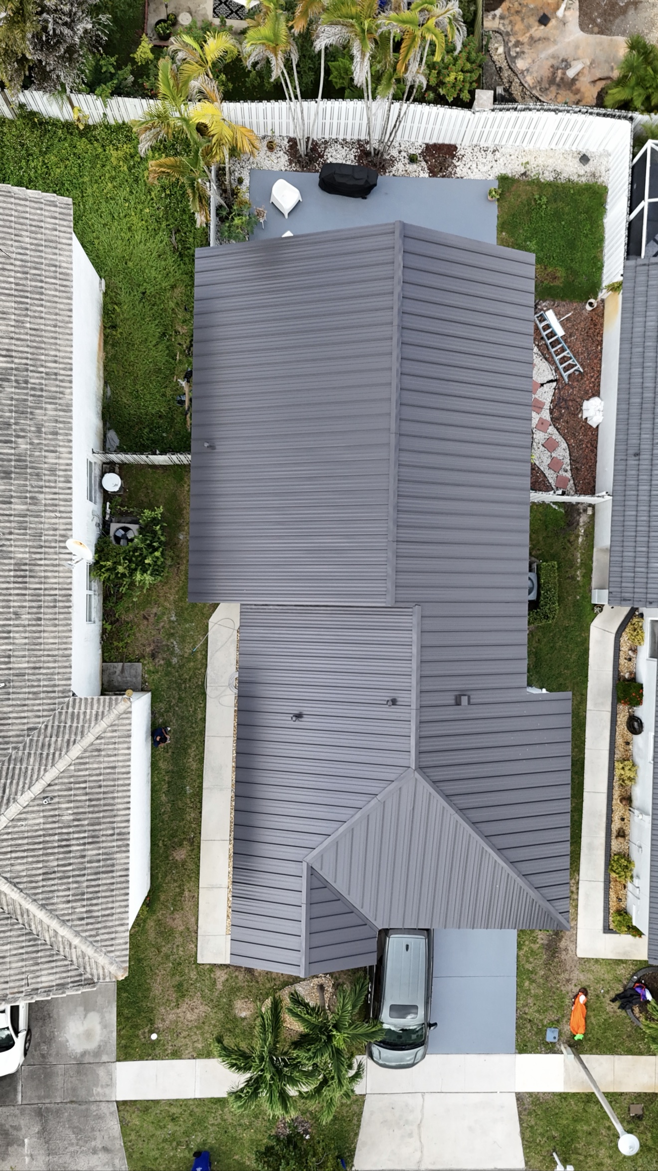 Top-down aerial of finished dark metal roof