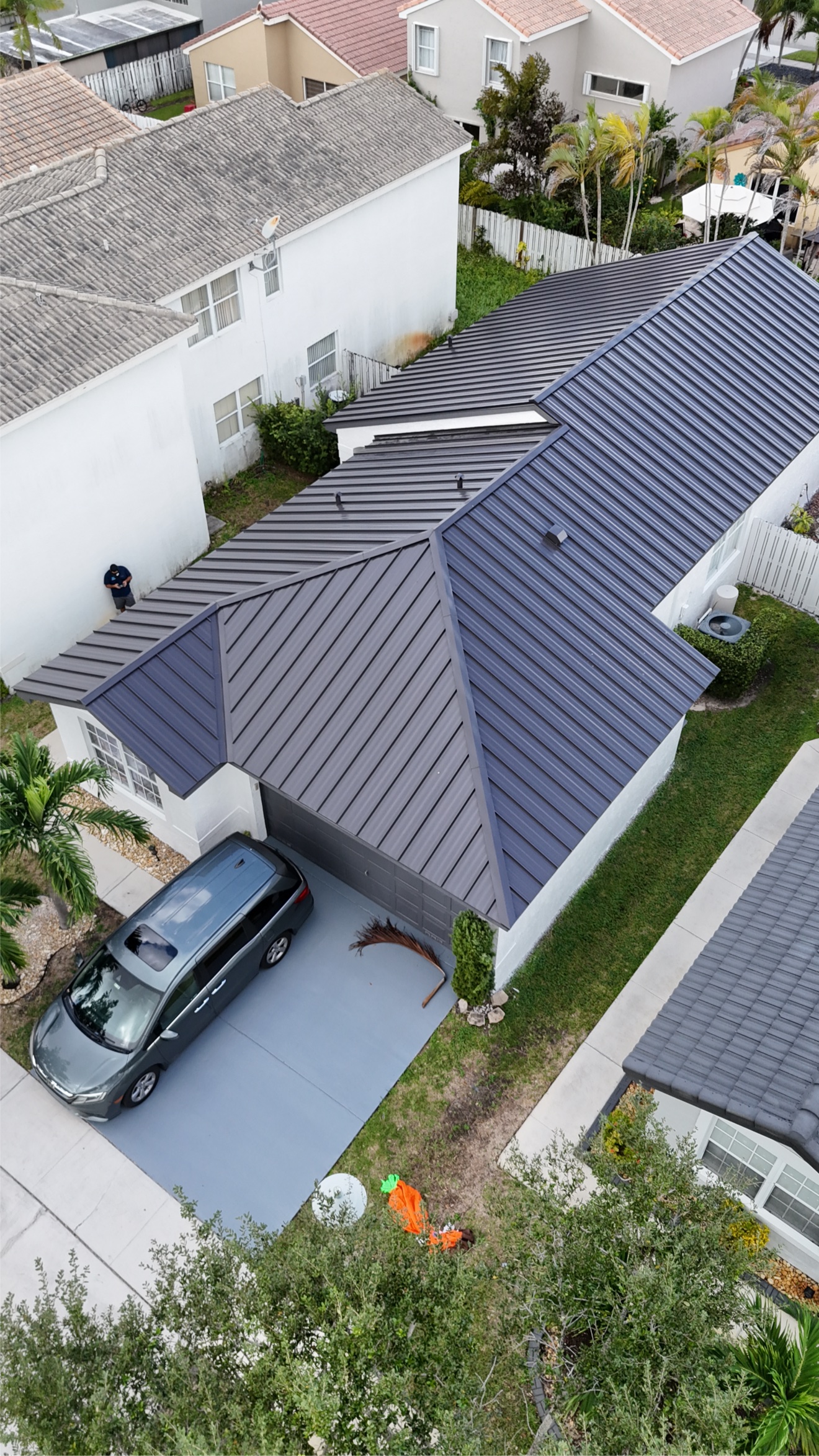 Aerial view of completed metal roof in the neighborhood