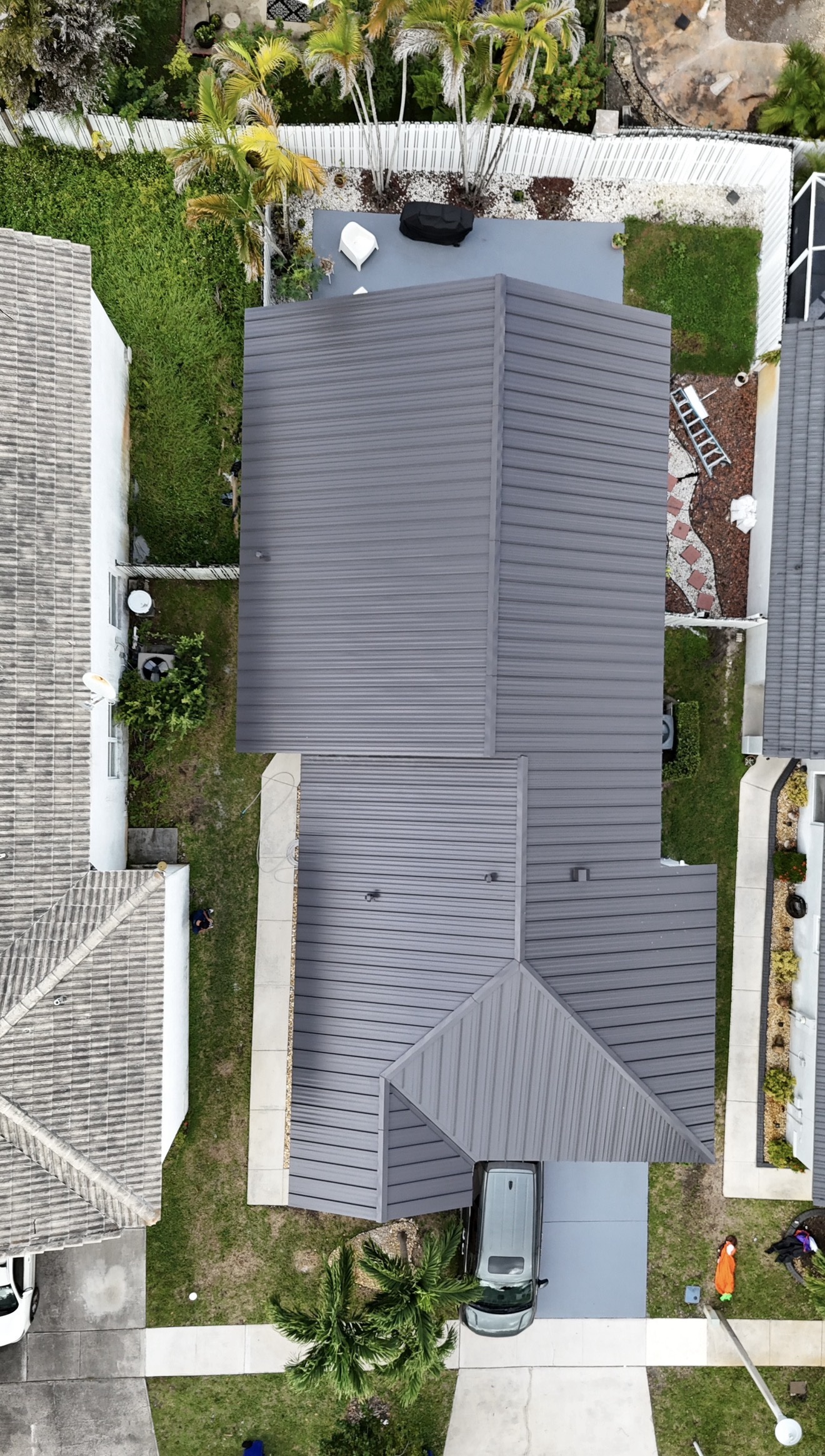 Aerial view of completed dark standing seam metal roof