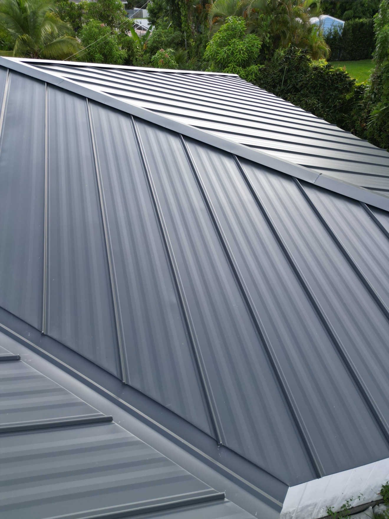 Aerial of completed metal roof on small house
