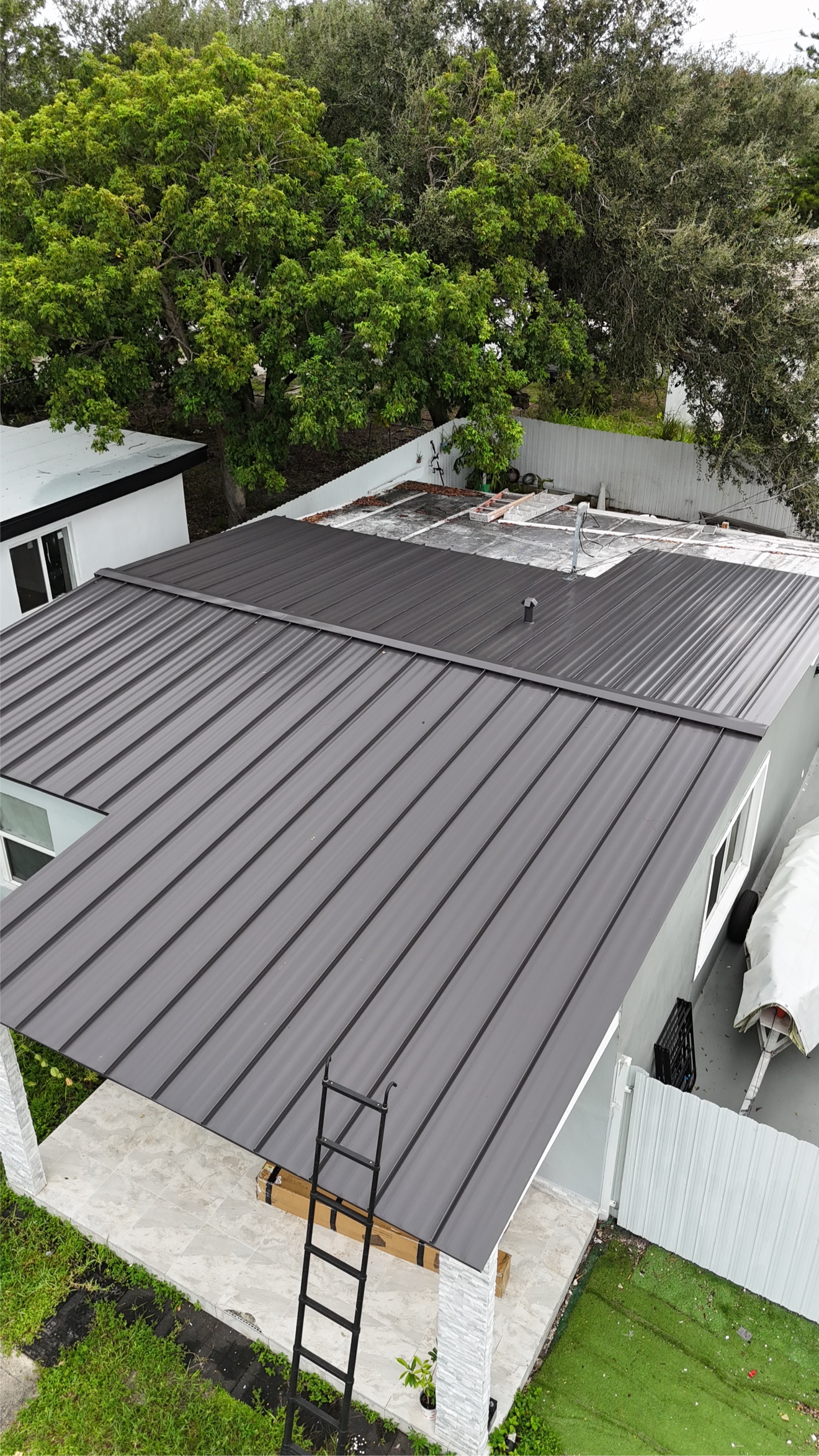 Aerial view of finished dark metal roof