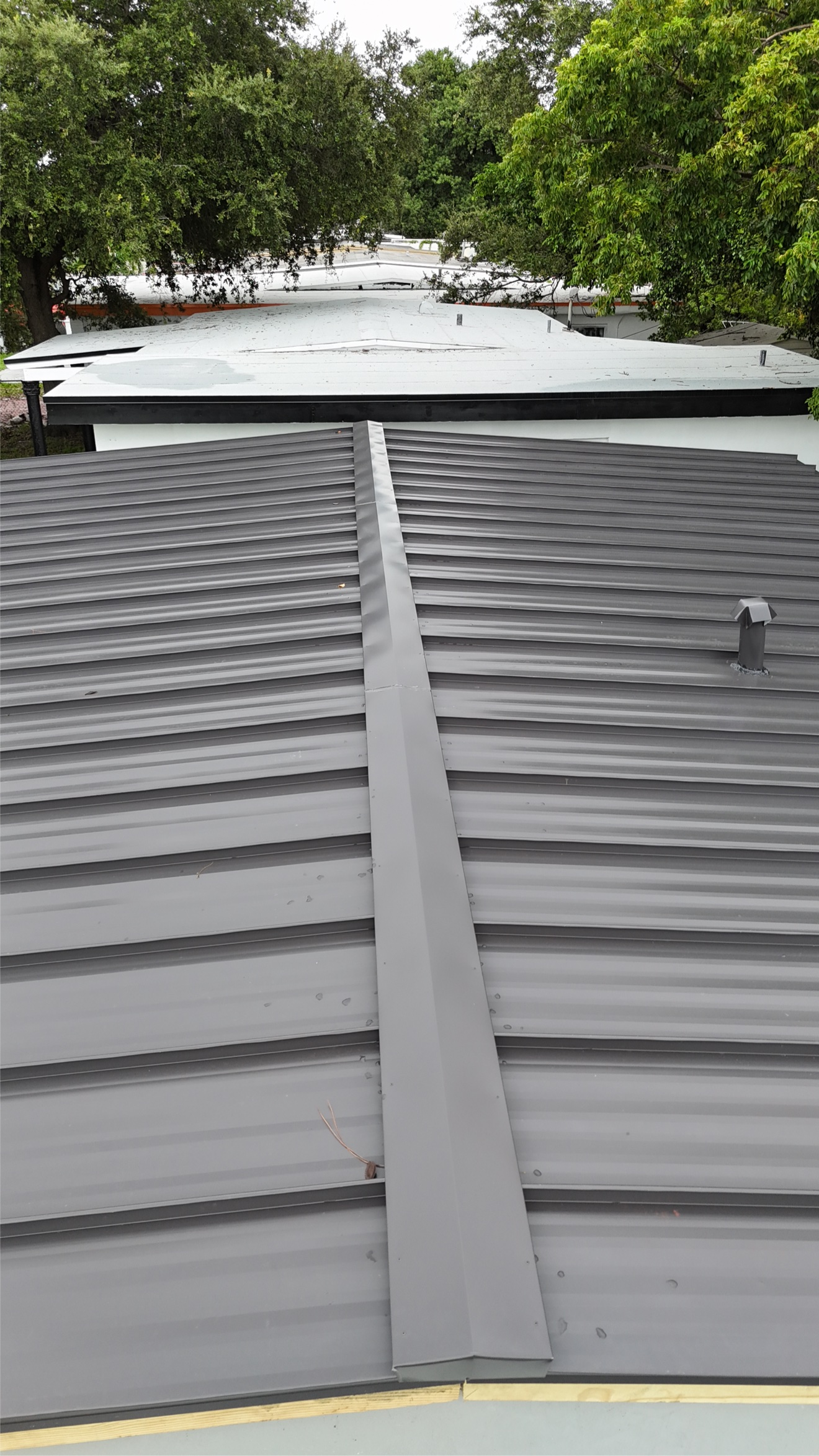 Aerial of metal roof with patio below