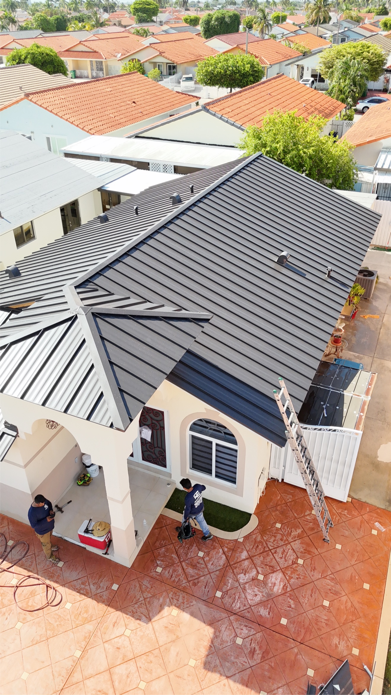 Aerial of a completed metal roof and driveway