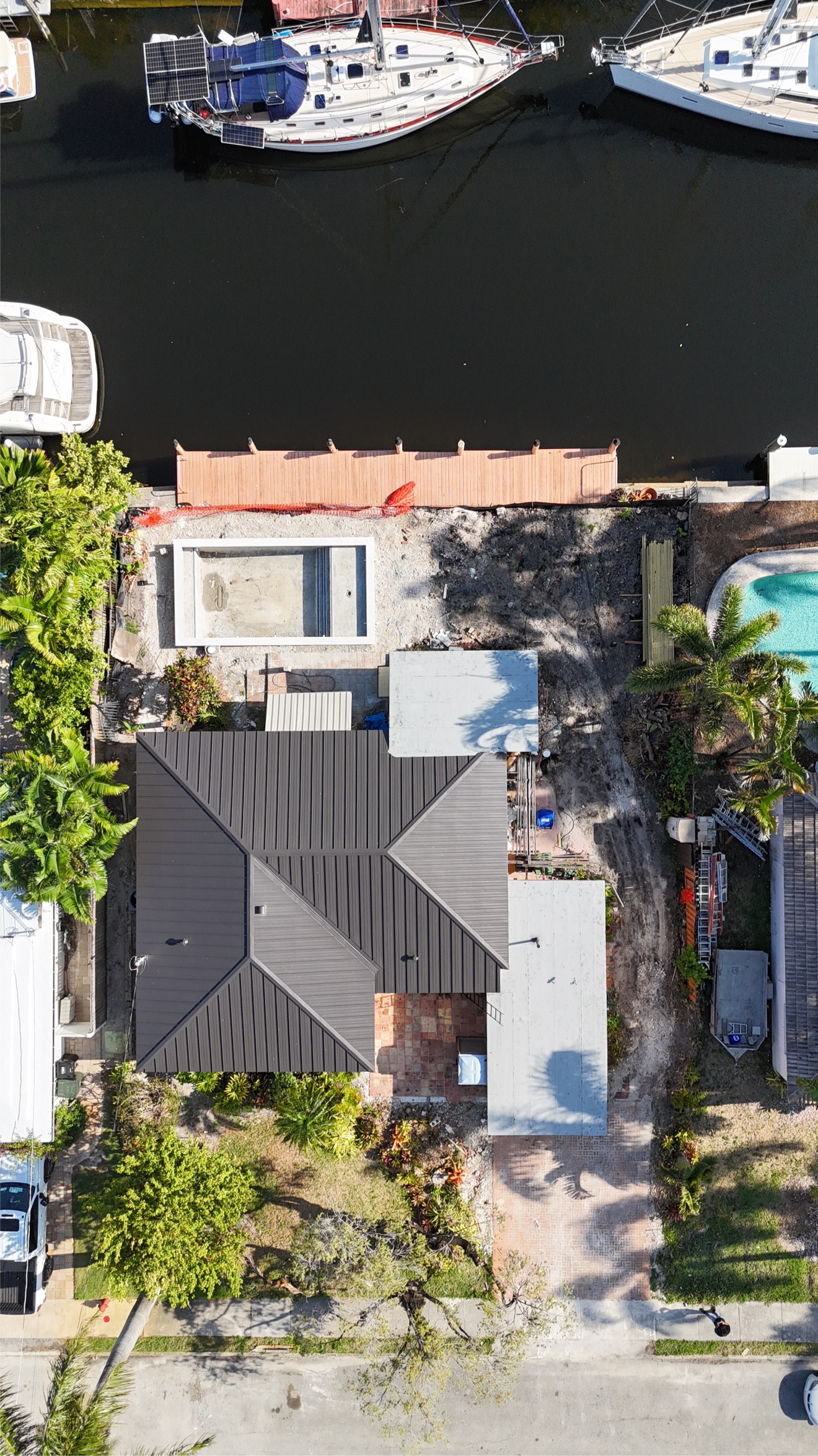 Aerial of a finished metal roof on a waterfront home