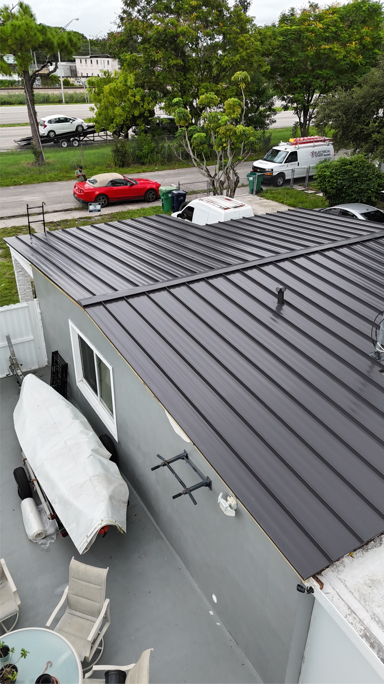 Close-up of finished metal roof panels over porch