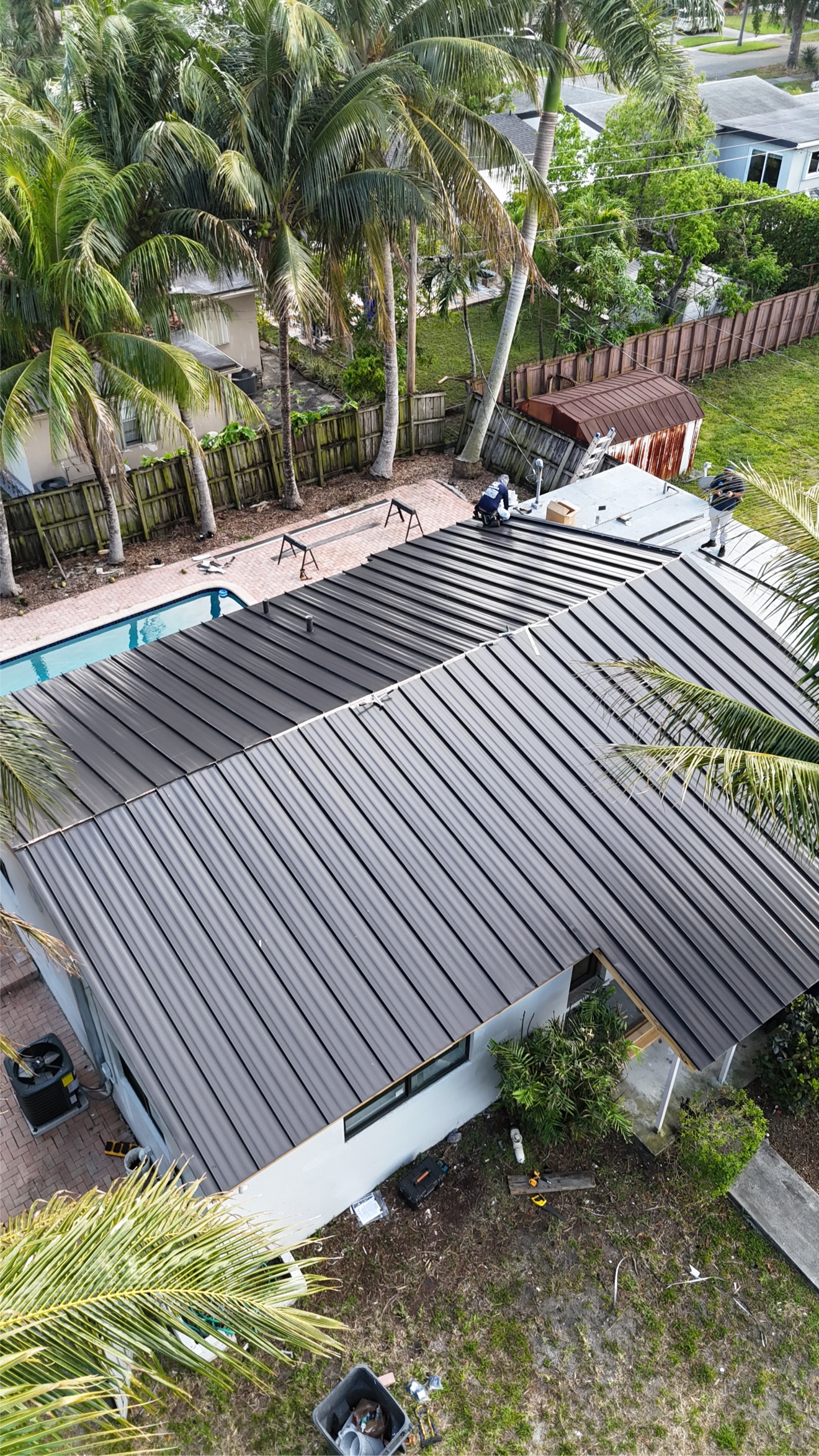 Finished metal roof from above showing clean panel lines