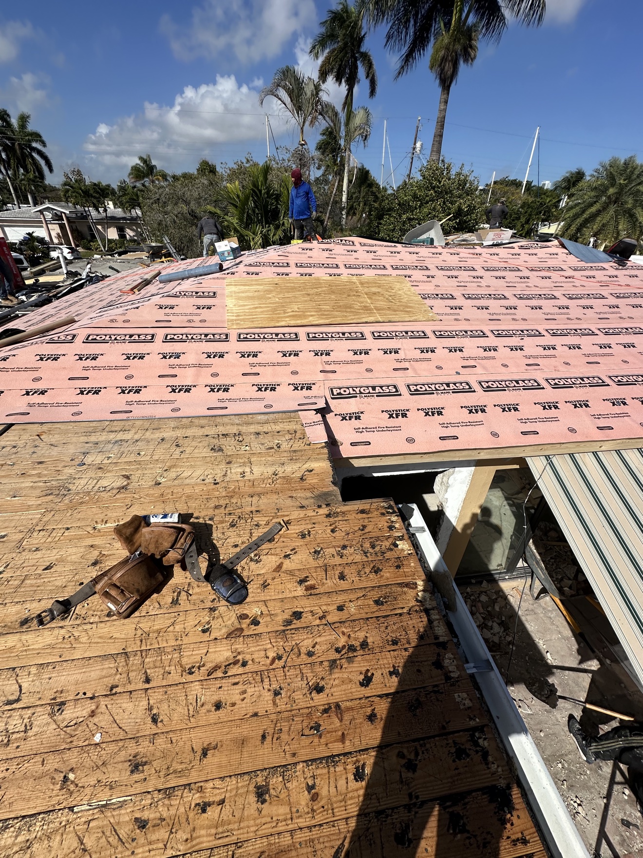 Polyglass underlayment going down on a waterfront roof