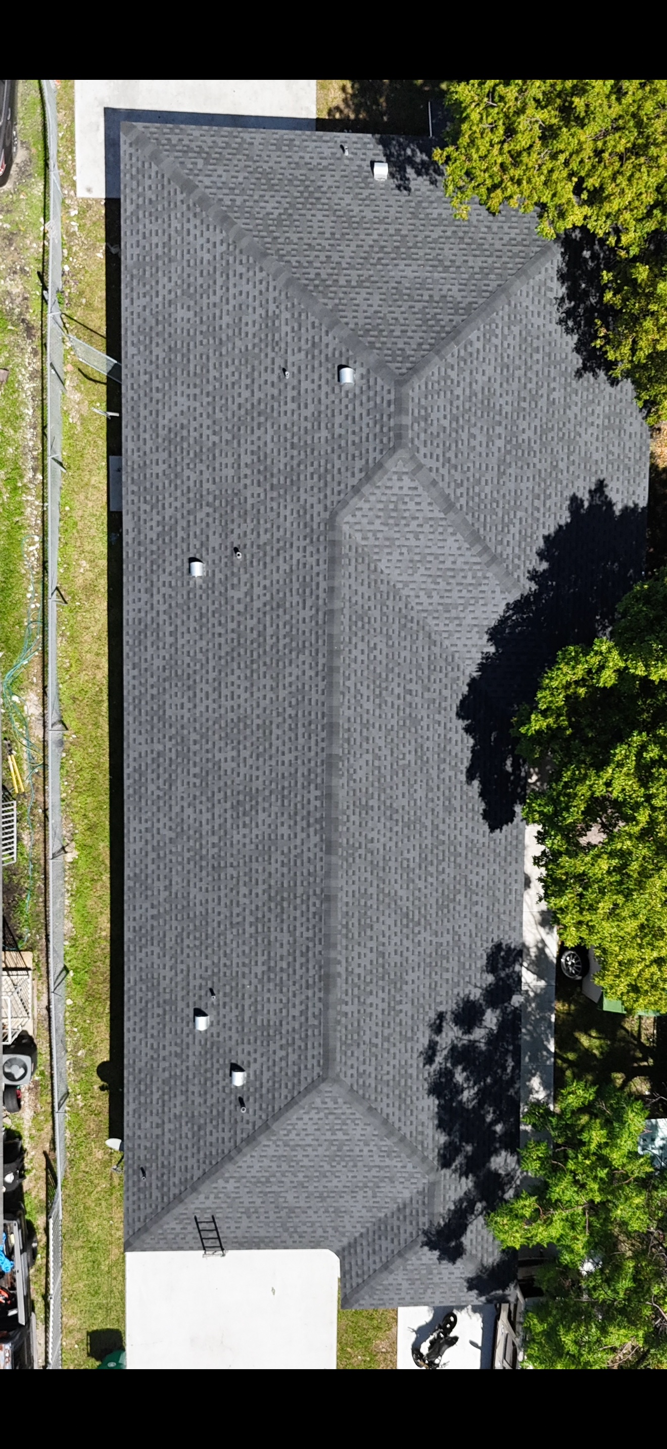 Aerial of a finished shingle roof from the other end