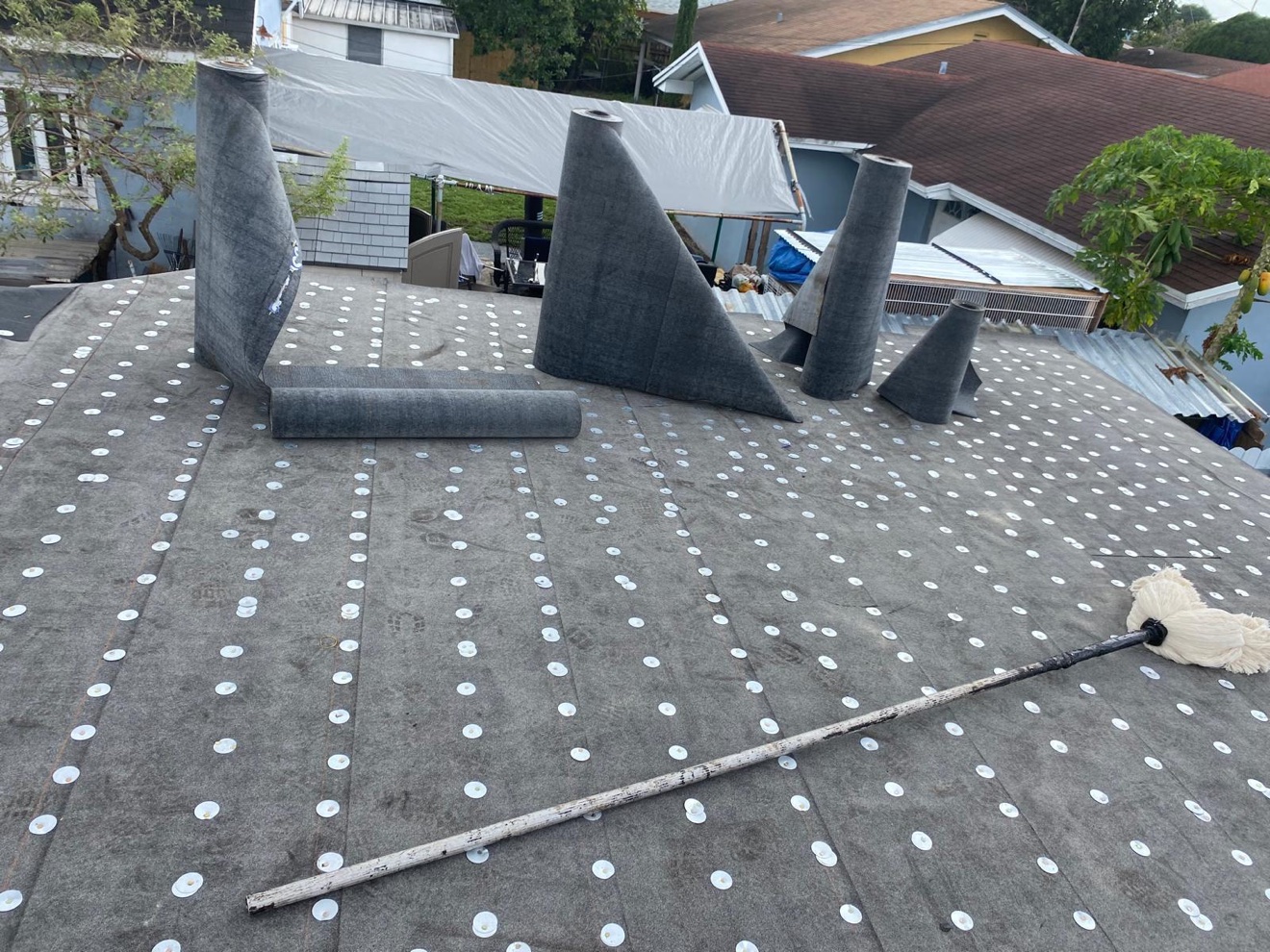 Mod-bit rolls on the flat section of a shingle job