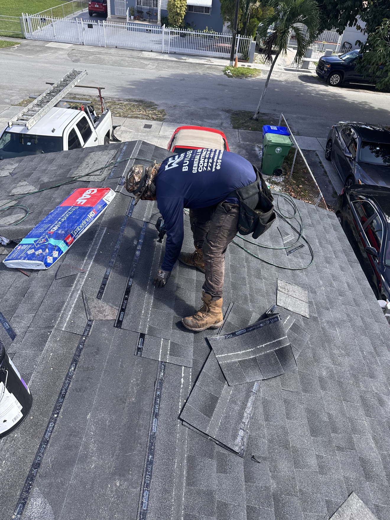 RE Builders worker installing GAF Timberline HD shingles