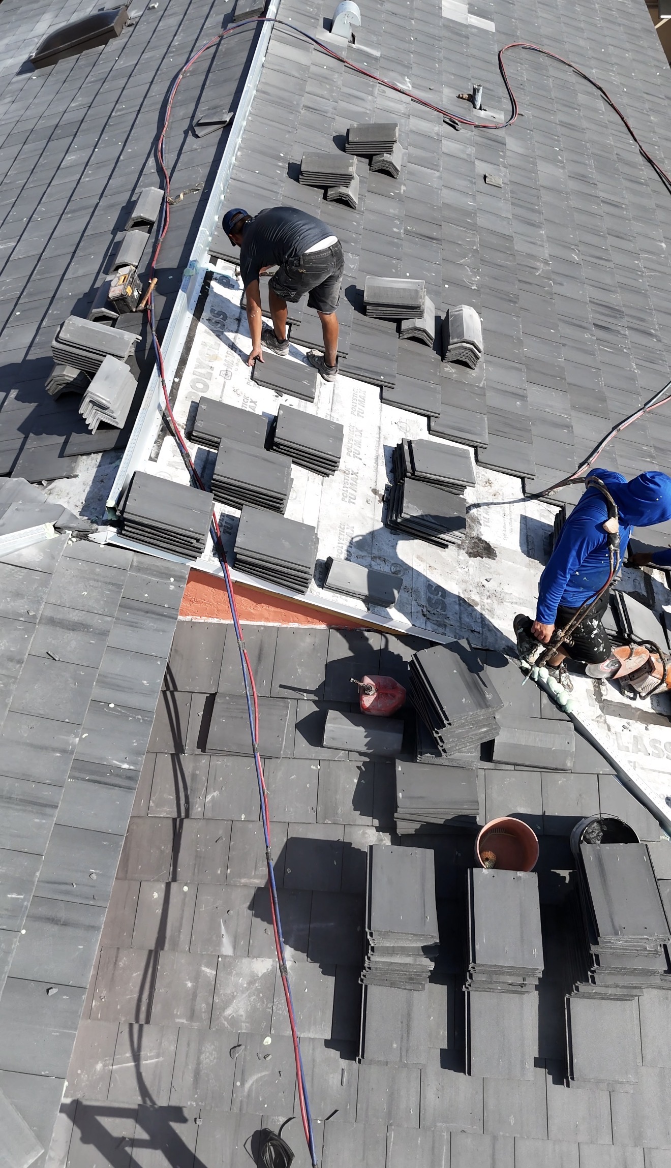 RE Builders crew working on a tile roof installation