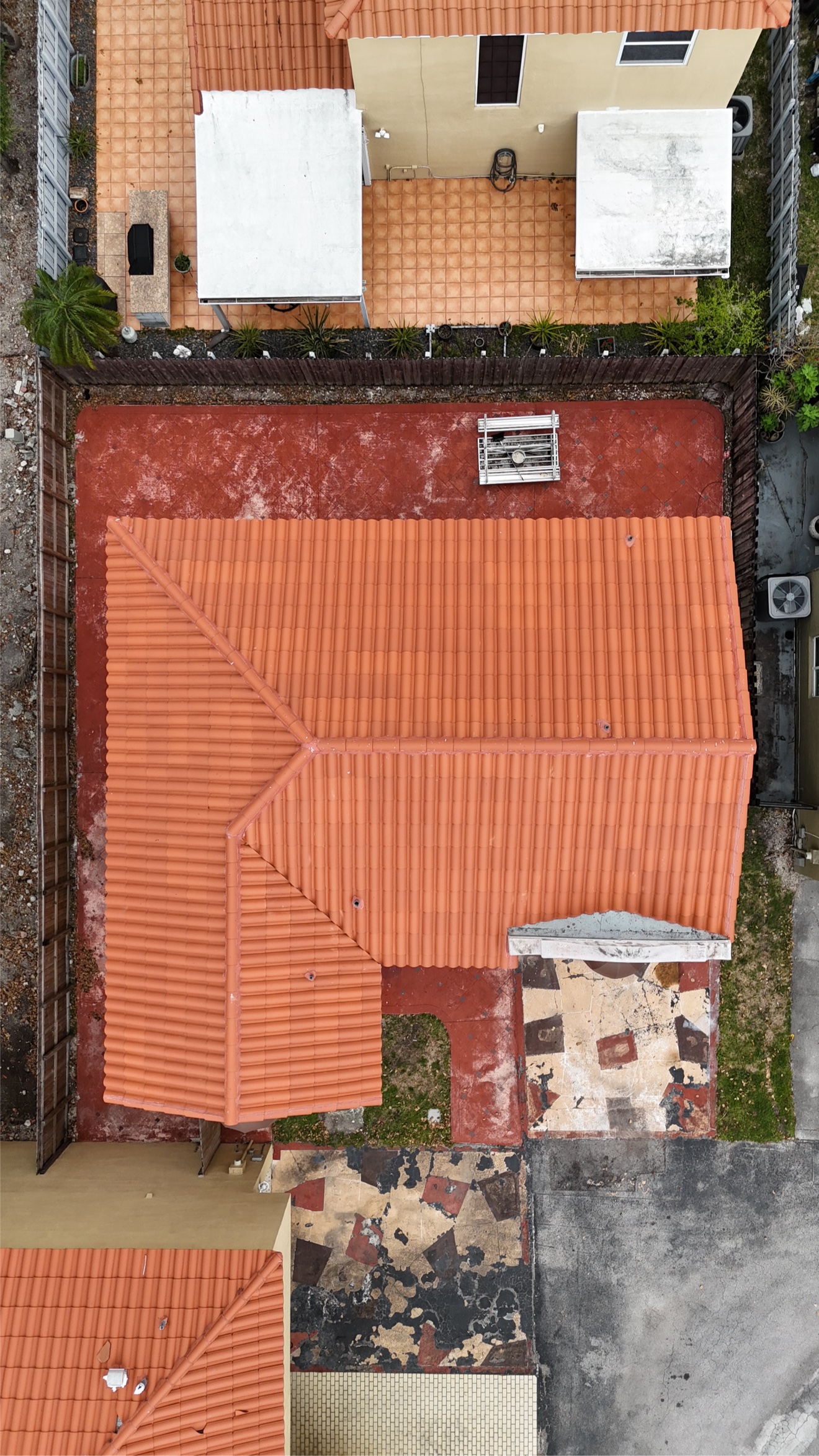 Aerial of a finished clay tile roof with parapet