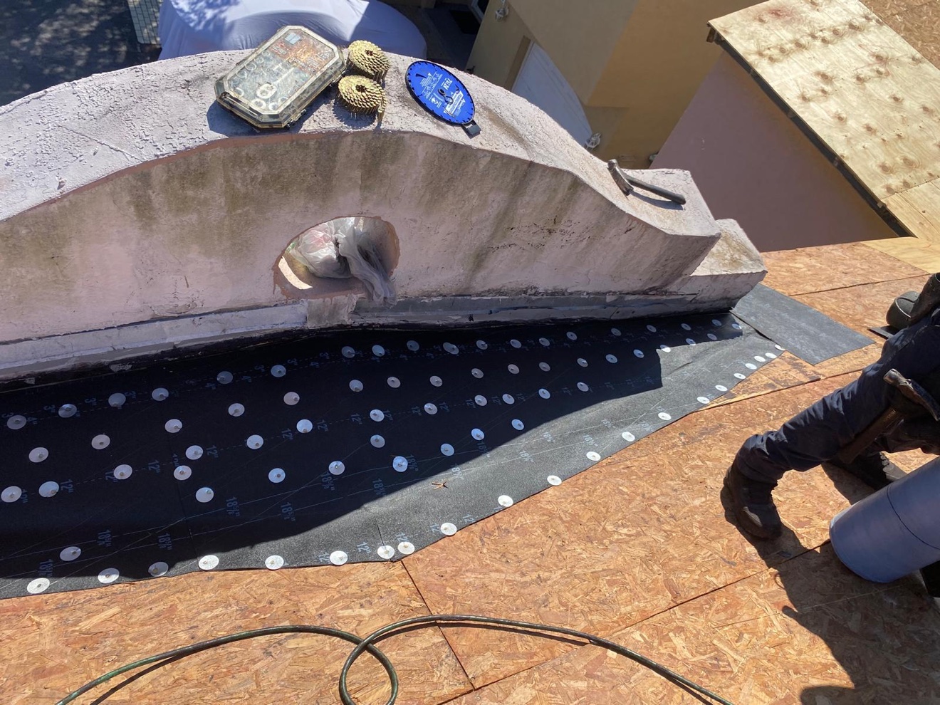 Close-up of fastened underlayment at the parapet